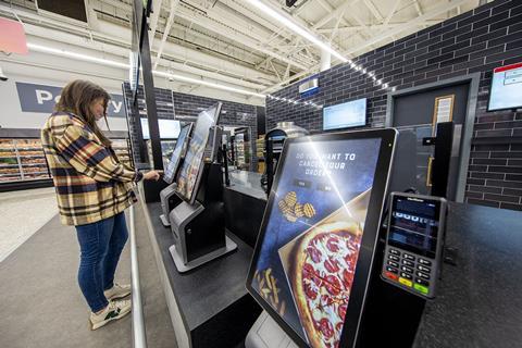 Women placing order on touchscreen at Asda Food Hub, Leeds Killingbeck store